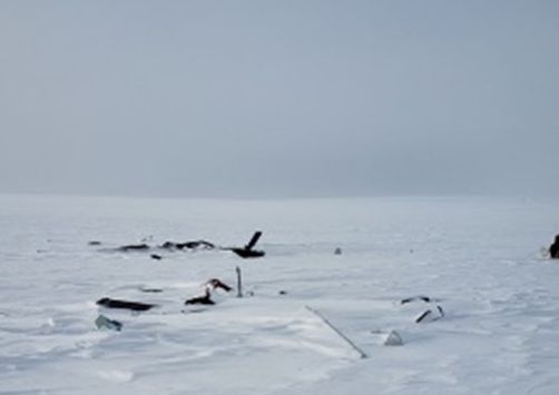 26 April 2021: The uniformly snow-covered, featureless terrain and overcast sky at the site of an accident in Nunavut (A21C0038)