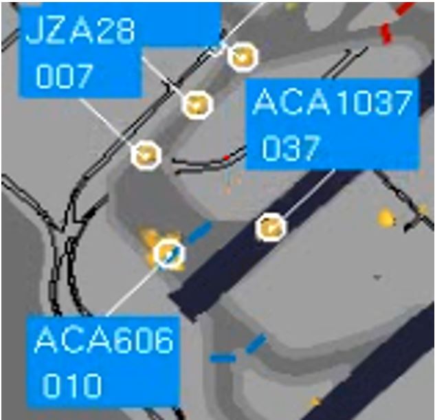 Screen shot magnification, taken at 0948:27, showing the track labels of a de Havilland DHC-8 (JZA28) travelling at 7 knots (007), the Boeing 777 (ACA606) travelling at 10 knots (010), and the Embraer 190 (ACA1037) travelling at 37 knots (037) (Source: NAV CANADA)