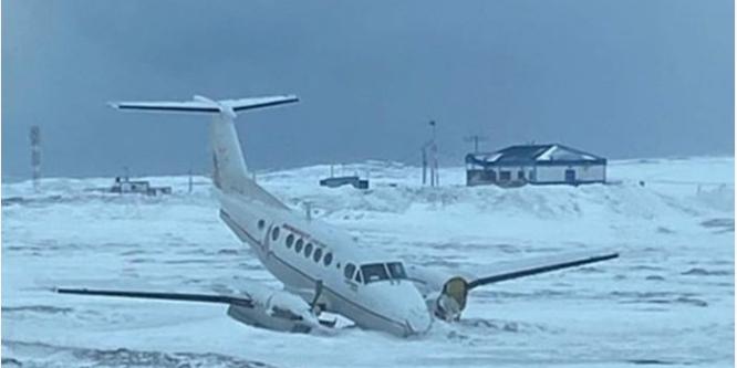 Figure 3. The occurrence aircraft after the runway excursion, stopped with the nose down (Source: Keewatin)